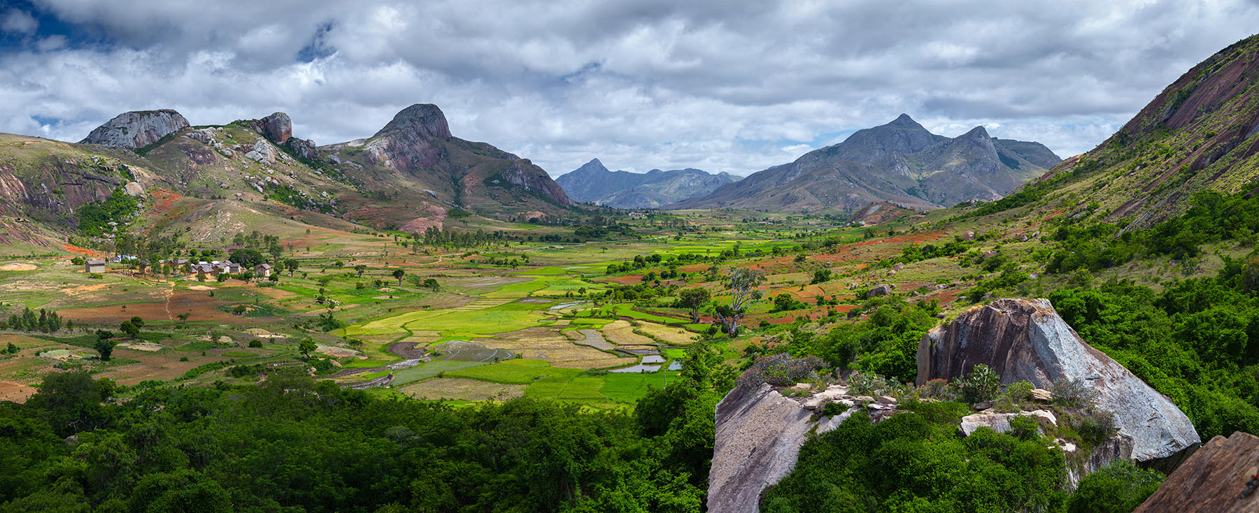 Green valley with rice fields and villages among mountains. Anja Green valley with rice fields and villages among mountains. Anja reserve, Madagascar